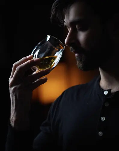 A enthusiast using the Norlan Whisky Glass (Clear) to nose his whisky.